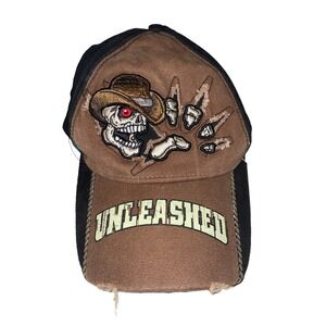 unleashed skull wearing cowboy hat and skeleton hand hat cap